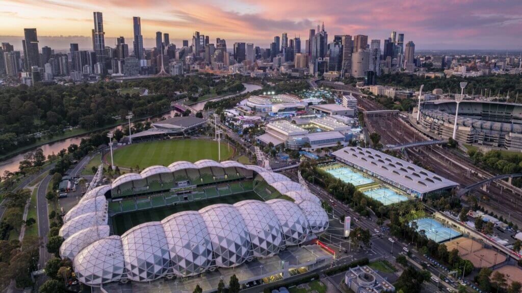 Aerial image of Melbourne Park with the city in the background.