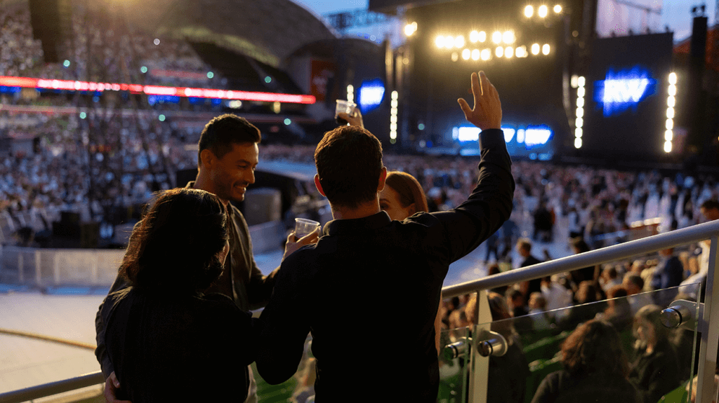A group of people enjoying a concert at AAMI Park.