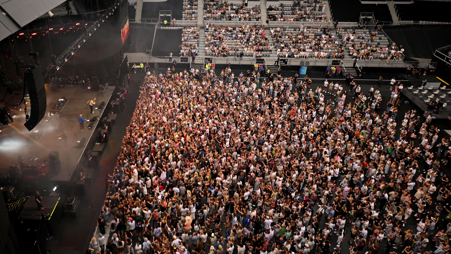A large crowd gathers in a stadium for a concert during the Australian Open.