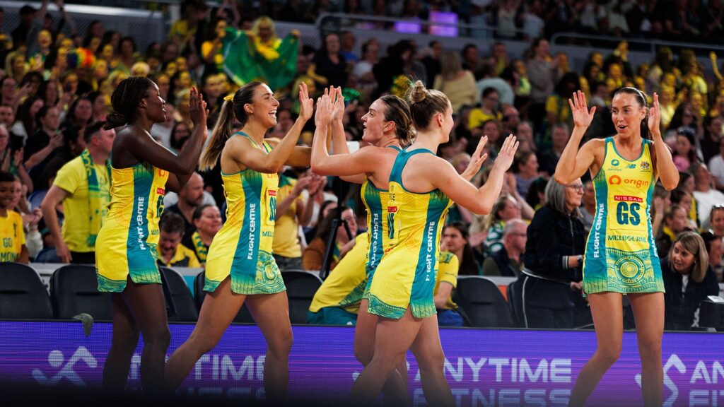 Australian Diamonds netball team celebrating at John Cain Arena.