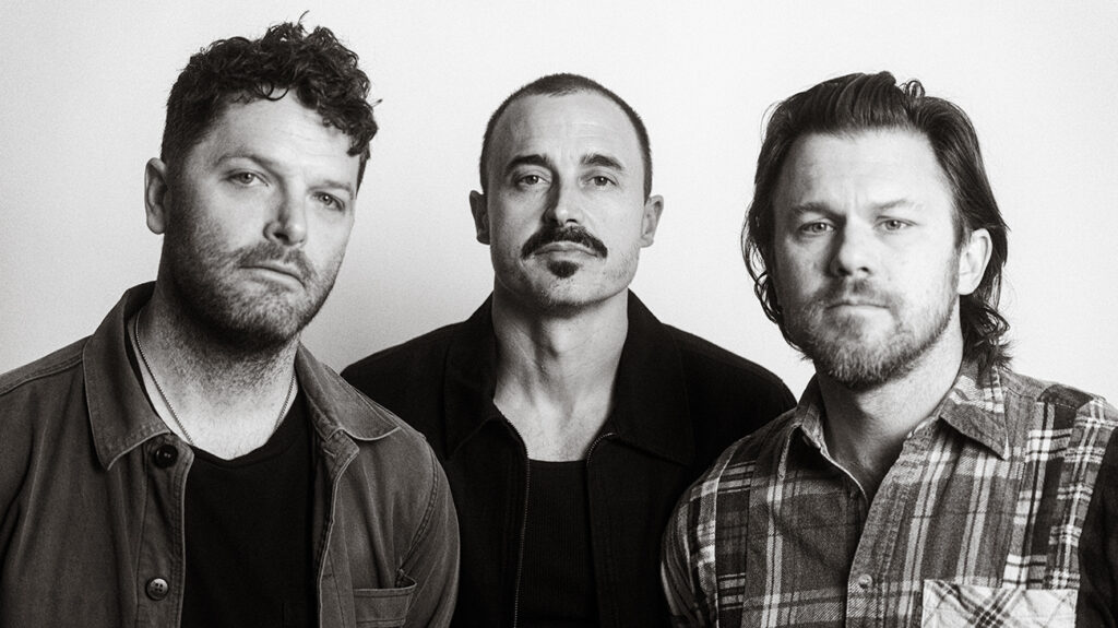 The Fray band members with serious poses against a white background.